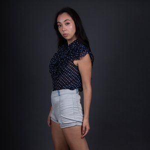 Blue polka-dot blouse with ruffles